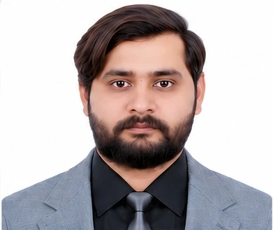 Portrait of Asad Raza in formal attire